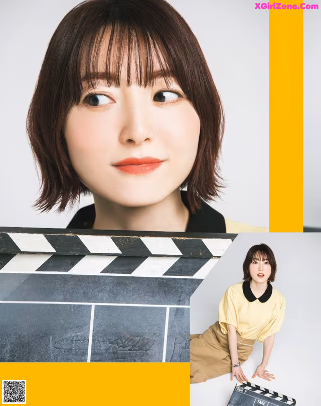 A woman holding a clapper board in front of her face.