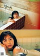 A woman in a bathtub with her head in the water.